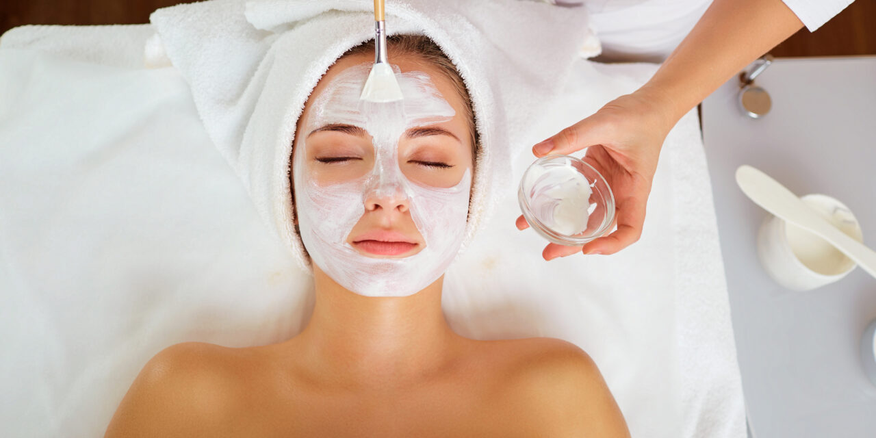 Woman in mask on face in spa beauty salon.