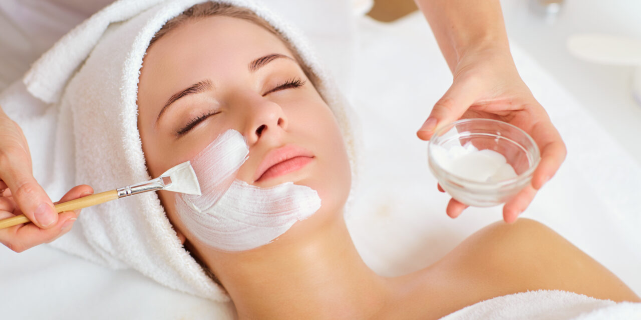 Woman in mask on face in spa beauty salon.